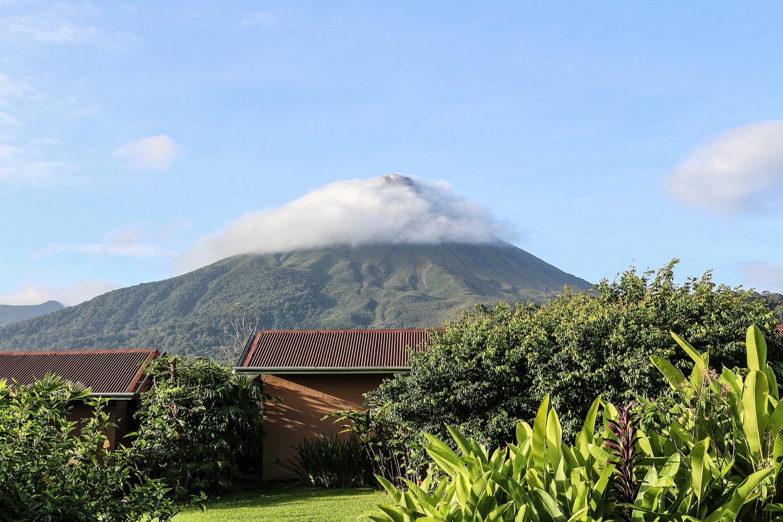 Arenal Volcano rising above green forest near La Fortuna, Costa Rica