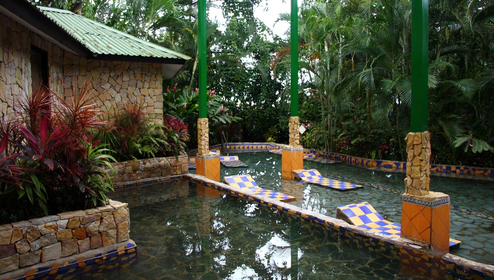 Terraced thermal pools and tropical greenery at a La Fortuna hot springs complex
