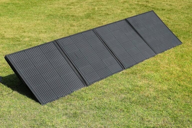 Portable folding solar panel set up on grass